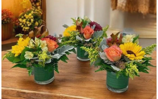 Fresh flower centerpieces for a round table.